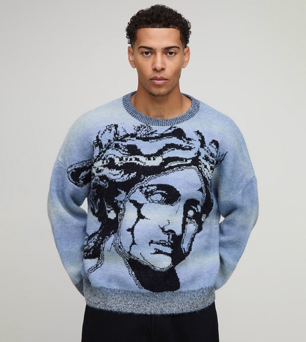 جمبر محبوك اوفرسايز مخطط بطبعة 