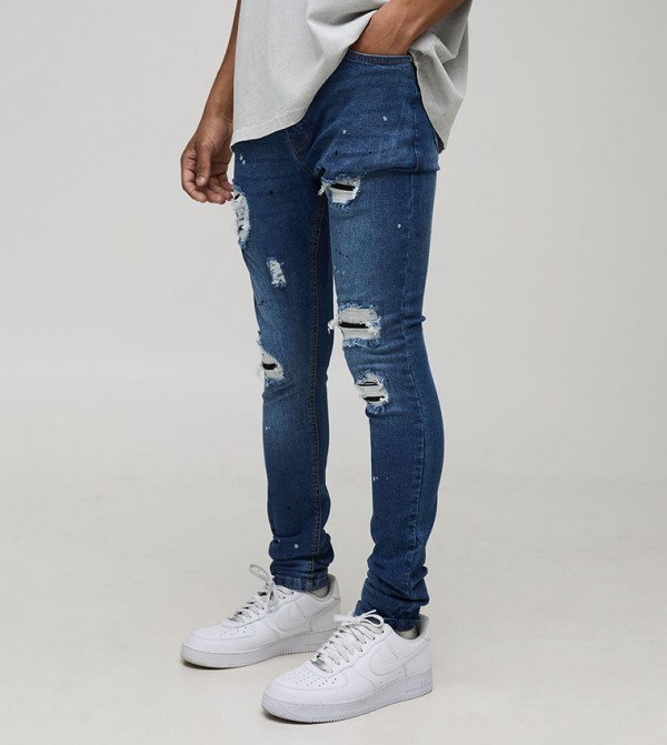 جينز ضيق ممزق بطبعة
