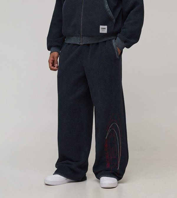 Reverse Distressed Woven Tab Wide Leg Sweatpants