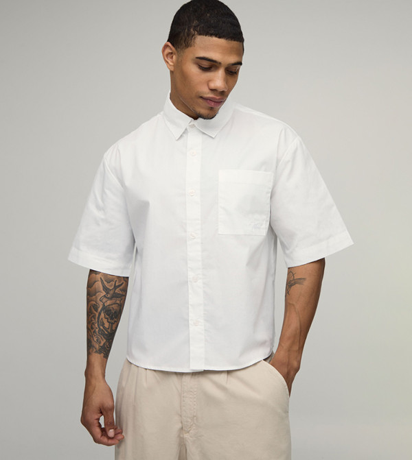 قميص أوفرسايز بكم قصير