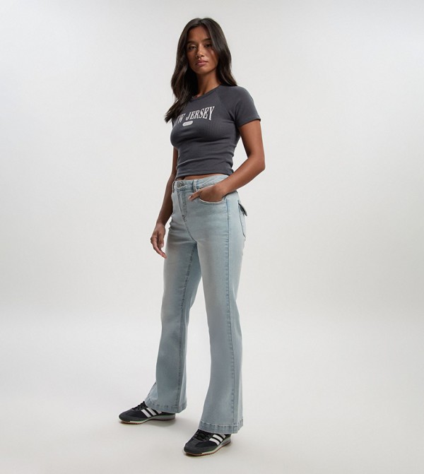 Petite Mid Rise Faded Flared Jeans