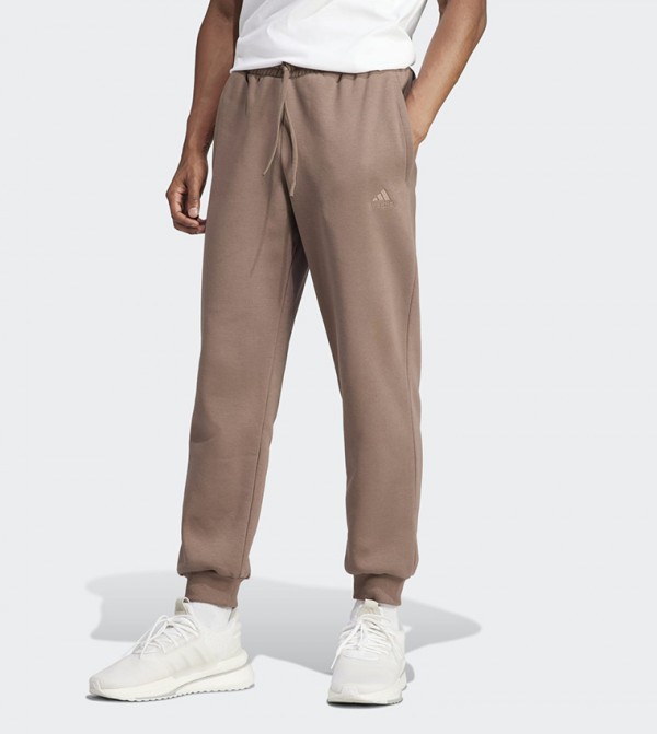 Adidas originals new neutrals logo cuffed joggers store