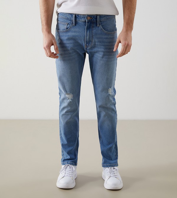 Ripped Mid Rise Slim Fit Jeans