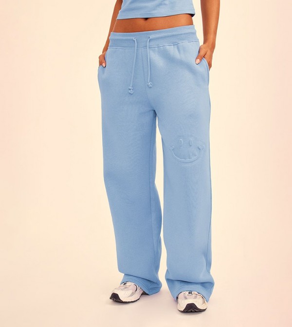 Steel Smile Embossed Wide Leg Sweatpants