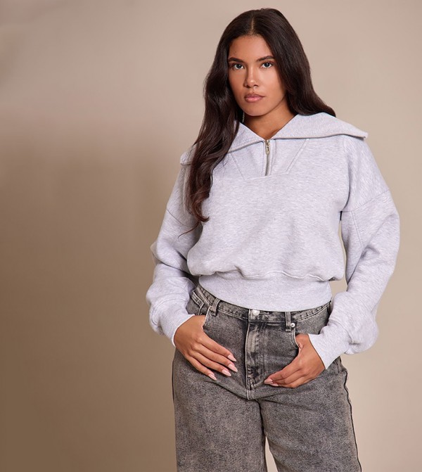 سويتشيرت أوفرسايز بخصر مزموم 