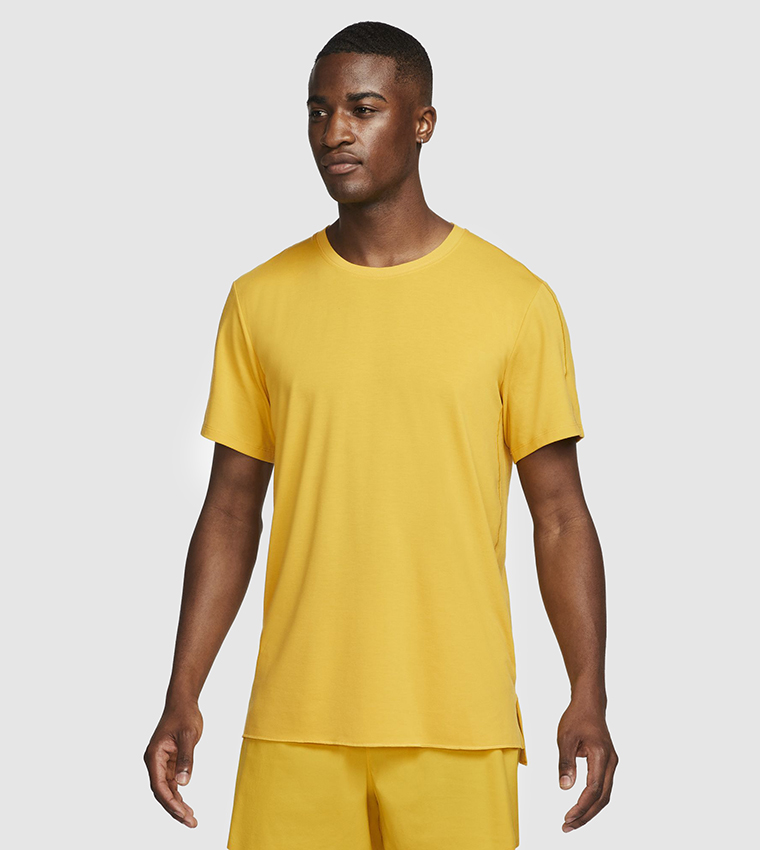 Buy Nike Dri FIT Yogo T Shirt In Yellow