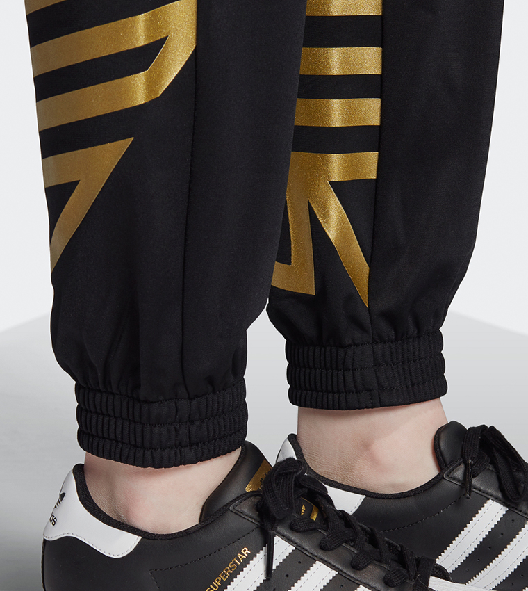 Adidas superstar track pants black gold online