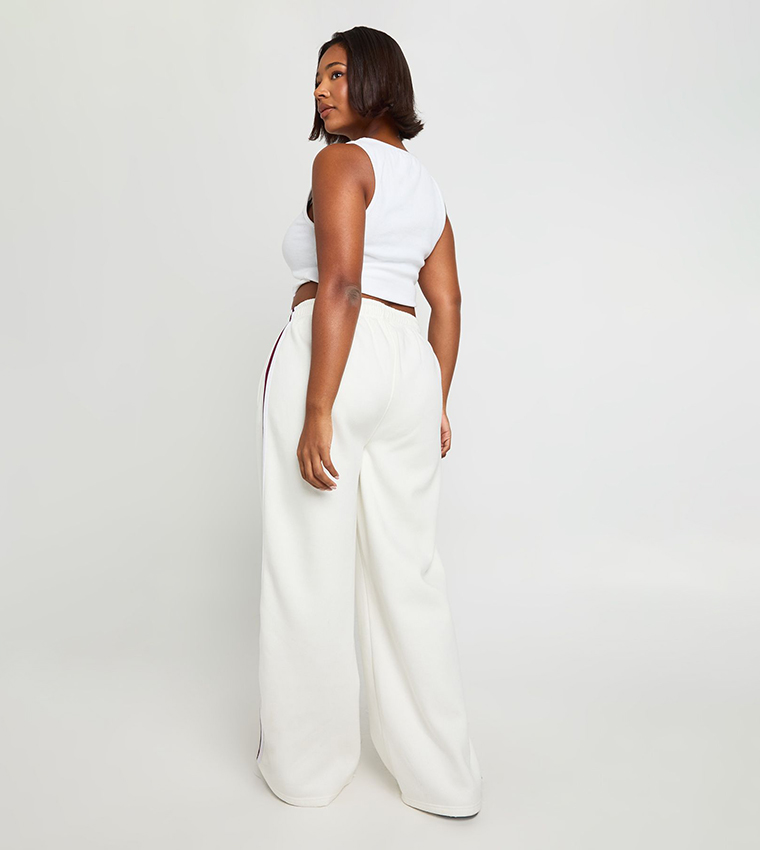 بنطال رياضة واسع بخطوط جانبية للمقاسات الكبيرة