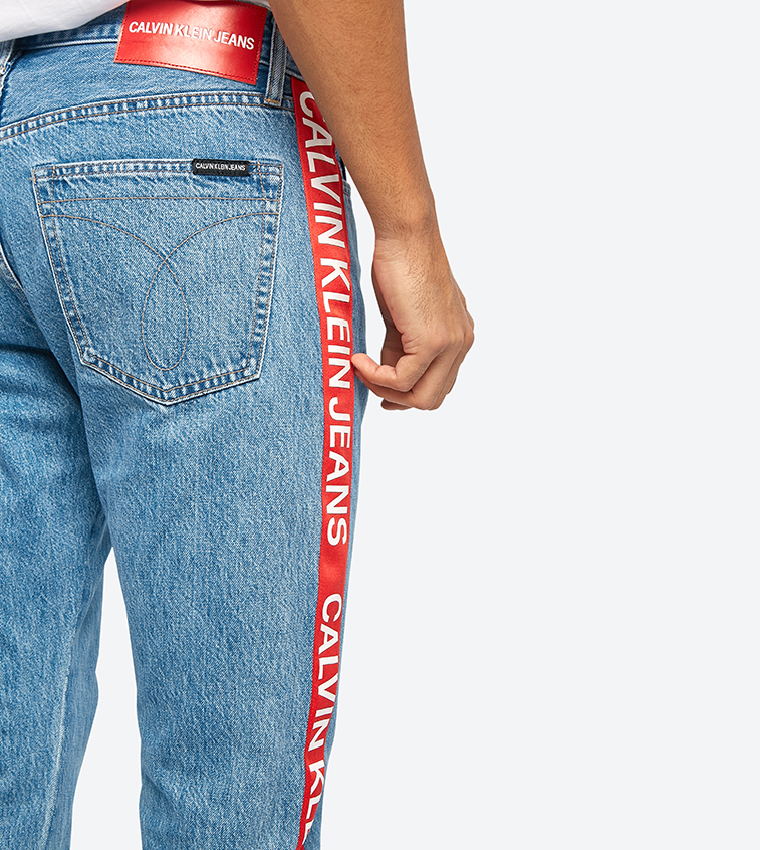 Calvin klein jeans store with red stripe