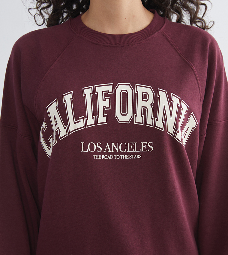 سويتشيرت أوفرسايز بطبعة وياقة مستديرة 