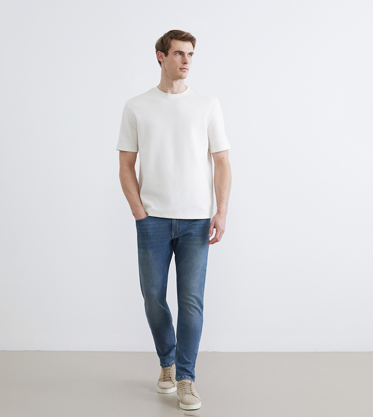 بنطلون جينز رجالي 750 مغسول بخصر متوسط وقصة ضيقة