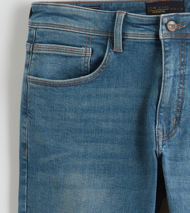 بنطلون جينز رجالي 750 مغسول بخصر متوسط وقصة ضيقة