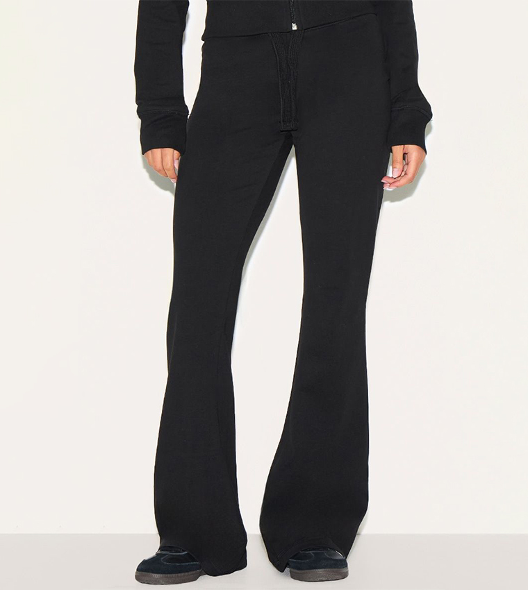 Buy PrettyLittleThing Petite Low Rise Skinny Flared Trousers In