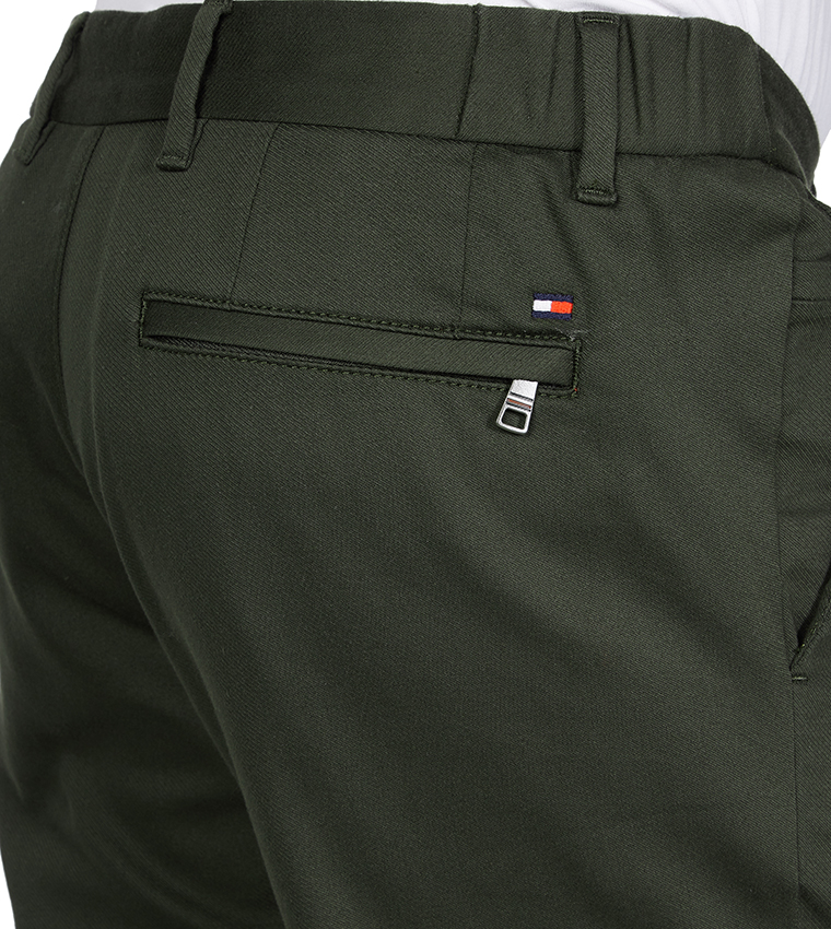 Buy Tommy Hilfiger Th Flex Tapered Trousers In Red | 6thStreet UAE